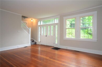 Living room also includes a staircase to the secon