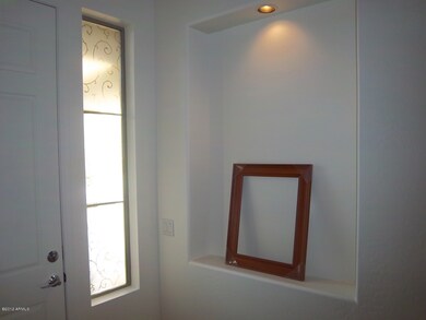 picture niche flanking front door