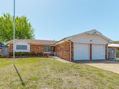 Ranch-style house featuring a garage, fence, a fro