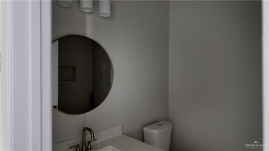 Bathroom featuring toilet and vanity