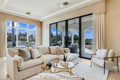 Tiled living room featuring ceiling fan