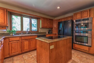 Eat-in Kitchen with granite countertops and lots of cabinet space.