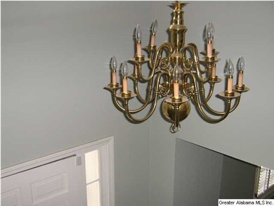 Beautiful chandelier hanging from 2nd floor into t