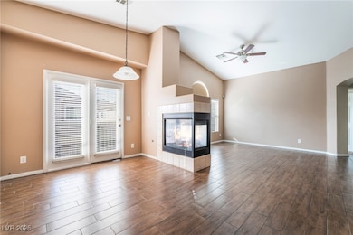 Unfurnished living room with dark wood-type floori