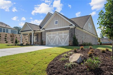Craftsman-style home featuring a garage and a fron