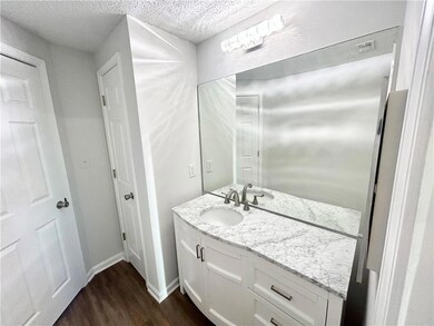 Bathroom featuring wood-type flooring, vanity, and