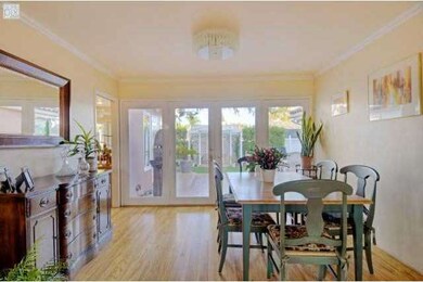 Formal dining with French Doors overlooking the pr