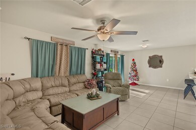 Tiled living room with ceiling fan