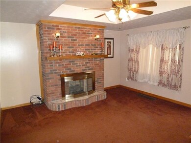 Floor to ceiling brick FP adds cozy winter warmth 