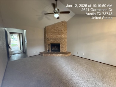 Unfurnished living room featuring ceiling fan, va