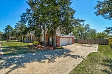 Large 3 car garage and big gate to access the back