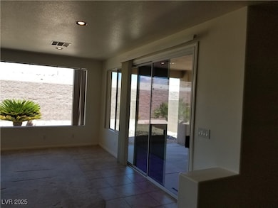 Doorway with carpet, tile patterned floors, visibl