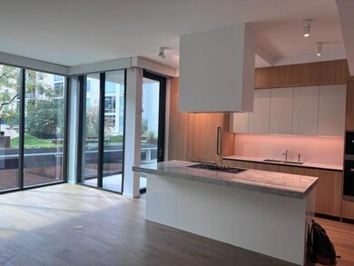 Kitchen with a sink, black gas cooktop, a center 