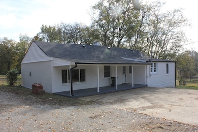 Large Back Covered Porch.  Large Concrete Slab for Parking or building that Garage!