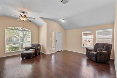 Living area featuring visible vents, dark wood-sty
