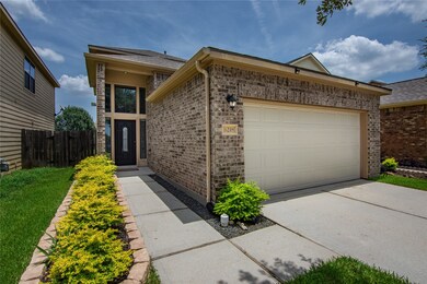 This charming home features a two-car garage and a
