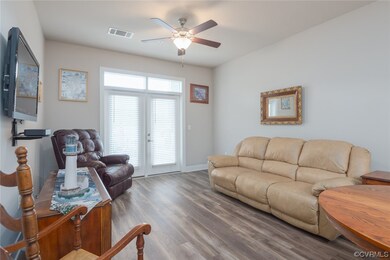 Living room featuring light hardwood floors, ceili