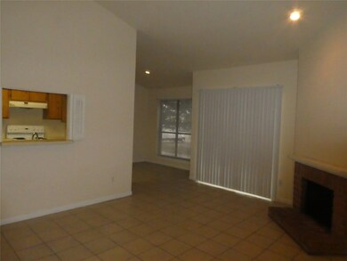Kitchen overlooks the living area.