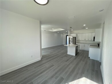 Kitchen with sink, a center island with sink, whit
