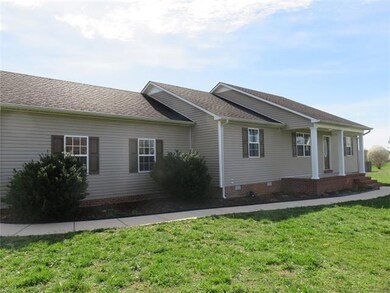 Another angle of this home with wonderful covered front porch. 