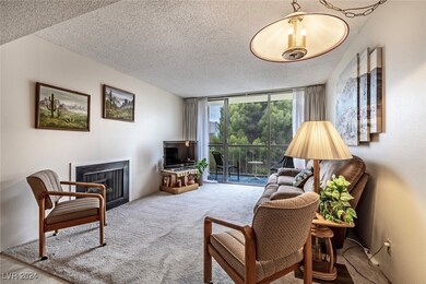 Living Room with Private Balcony & Fireplace