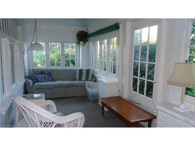 Relax on your enclosed front porch, so charming!