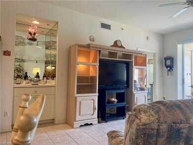Living room featuring bar and entertainment unit, 