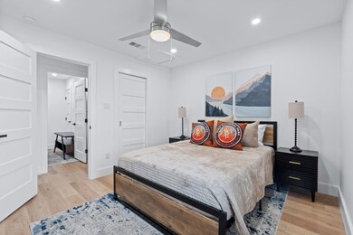 Bedroom featuring light wood-style floors, basebo