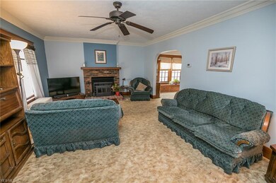 The spacious living room is highlighted by a working fireplace.