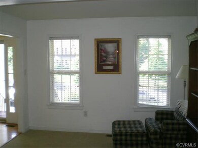 Living room features two windows that provide plen