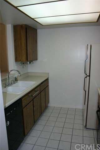 Galley style kitchen has sink and prep area on the