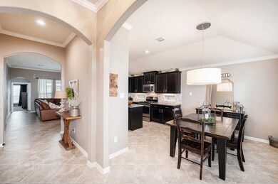 As you enter this immaculate home, you'll notice extensive tile flooring, neutral paint colors, crown molding and lovely archways.