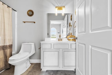 Bathroom featuring vanity, tile patterned floors, 