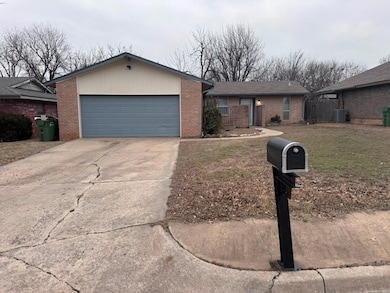 View of front of property with a garage, driveway,