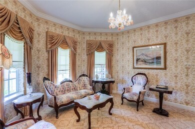 Formal sitting parlor with egg and dart crown mold