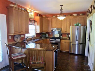 Upgraded Eat-in Kitchen is accentuated with Tastef
