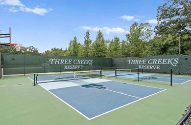 View of tennis court featuring community basketball court