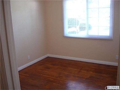 Bedroom with Refinished Wood Floors