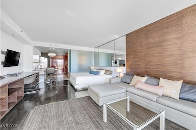Living room featuring dark wood-style flooring