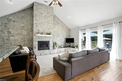 living room with vaulted ceilings and natural light