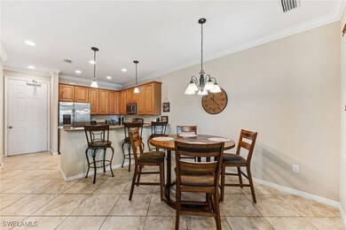 Dining area featuring crown molding, a chandelier,