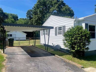 Front corner/side view and carport