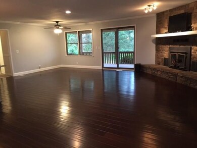 Living Room . . . note the beautiful wood floors & fireplace.