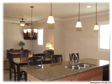 A view from the kitchen into the dining area and k