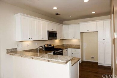 The beautifully remodeled kitchen features gleamin