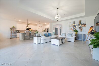 Living area featuring light tile patterned floors,