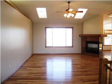 A view of the living room with the hickory floors,