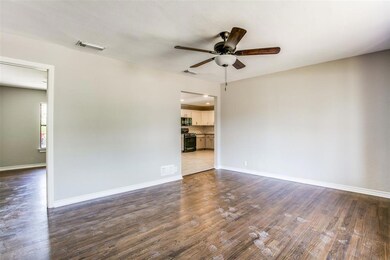 Living room. The semi-open floor plan is perfect for those who prefer a bit more formal feel.
