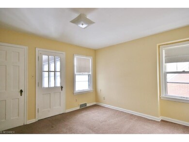 Bedroom 2 with door to back porch.