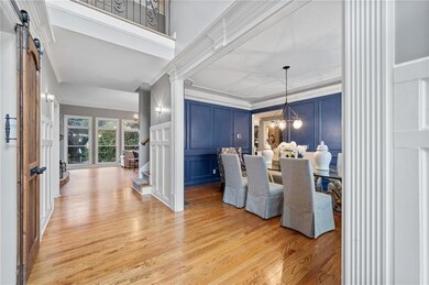 Dining space featuring ornamental molding, a barn 